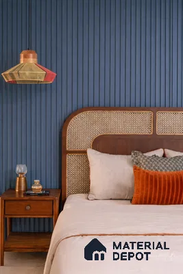 Mid-century modern bedroom with blue fluted wall panels and cane headboard