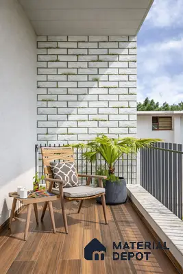 Scandinavian balcony with wood-look floor tiles and white brick cladding wall