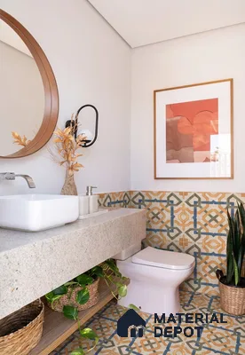 Modern bathroom with patterned geometric floor and wall tiles and beige stone countertop