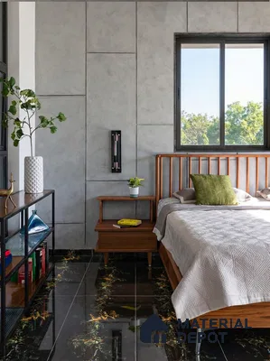 Mid-century modern bedroom with concrete wall panels and black marble floor tiles