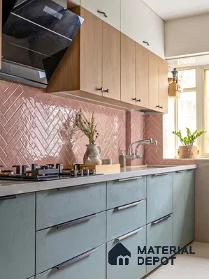 Modern kitchen with pastel blue laminate, oak wood laminate, and blush pink herringbone subway backsplash tile