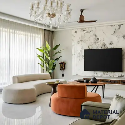 Modern living room with marble-look TV wall, white marble floor tile, and curved upholstered seating of 3 BHK apartment in Prestige North Point Kalyan Nagar in Bengaluru