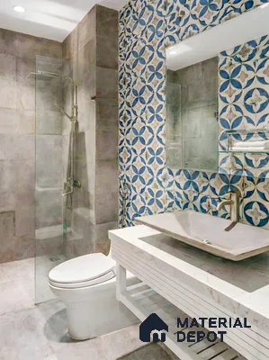 Modern bathroom with blue and beige geometric patterned wall tiles and marble countertop vanity