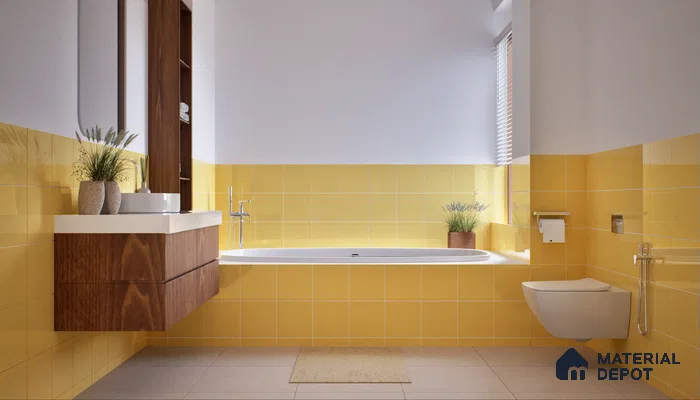 A modern bathroom with vibrant yellow tiled walls, wooden vanity, and a white bathtub, creating a cheerful and clean atmosphere. | Material Depot