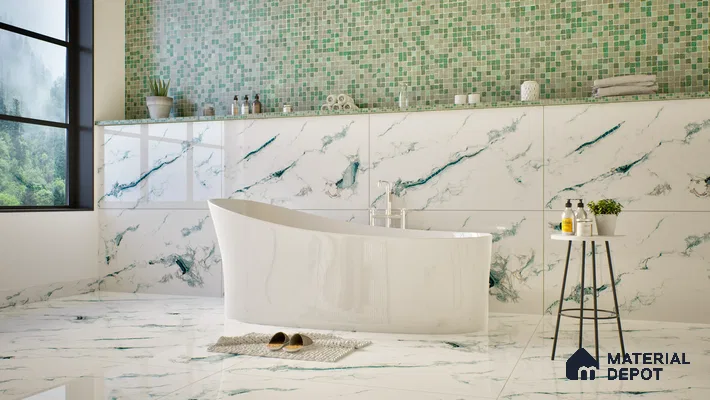 Elegant bathroom featuring green mosaic tiles, marble walls, and a modern freestanding bathtub. | Material Depot