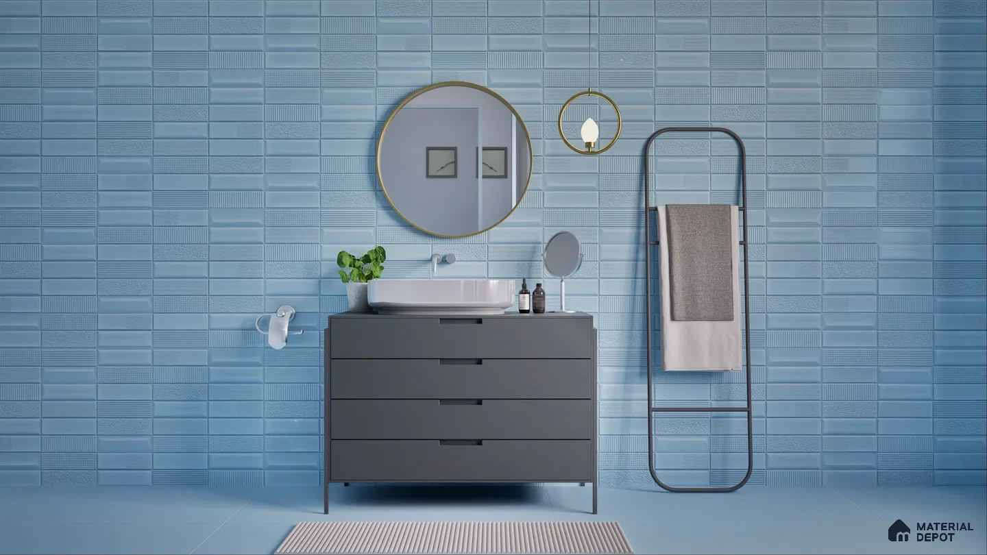 Sleek bathroom design featuring blue textured tiles, a dark grey vanity with a white basin, round mirror, and minimalist towel rack. | Material Depot