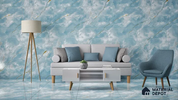 A contemporary living room featuring blue marble walls and flooring, a light gray sofa with blue pillows, a blue armchair, a tripod floor lamp, and a white coffee table. | Material Depot