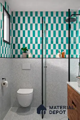 Modern bathroom with turquoise geometric wall tiles and terrazzo floor tiles