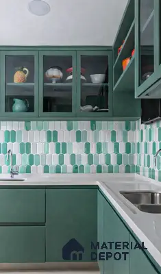 Modern kitchen with sage green laminate cabinets, white quartz countertop, and green-white geometric backsplash tiles