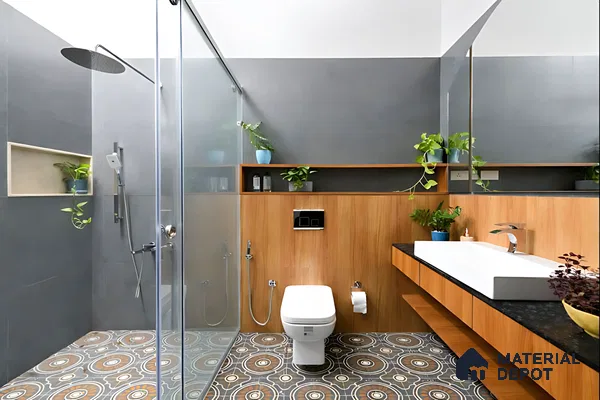 Modern bathroom with grey wall tiles, wood-look laminate vanity, and geometric patterned floor tiles