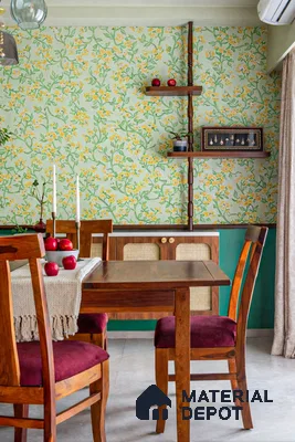 Eclectic dining room with floral wallpaper, natural wood dining set, and cane cabinet