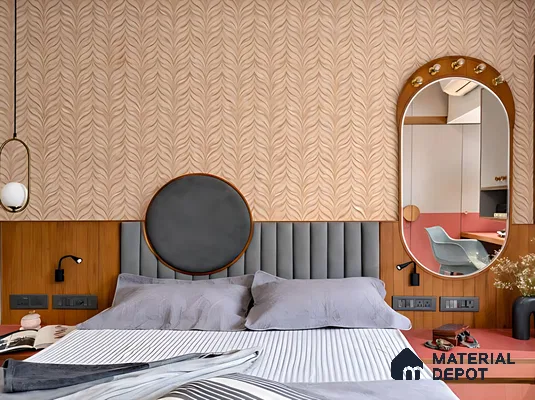 Modern bedroom with patterned beige wallpaper, grey suede upholstered headboard, and wood laminate wall panel