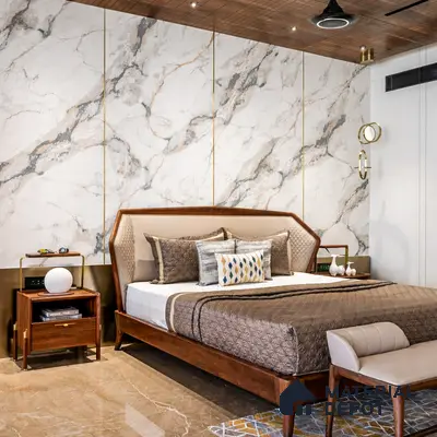 Modern bedroom with marble-look wall panels and walnut wood furniture in 3 BHK apartment SLV Parkview Apartment Bengaluru
