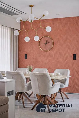 Modern dining room with terracotta herringbone wall panel and beige upholstered chairs in 3 BHK apartment SLV Parkview Apartment Bengaluru