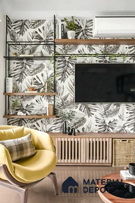 Modern living room with tropical patterned wallpaper, wooden louver TV unit, and beige glossy floor tile of 3 BHK apartment in SMR Vinay Galaxy Hoodi Bengaluru