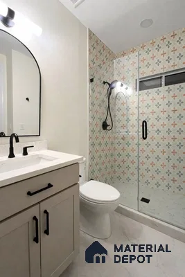 Modern bathroom with patterned floral wall tiles and white marble-look floor tiles