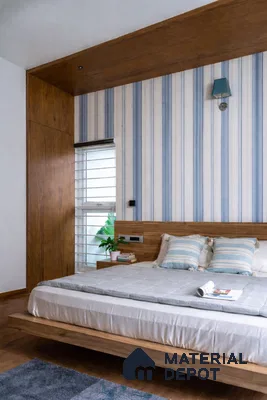 Scandinavian bedroom with wood laminate paneling and blue striped wallpaper