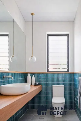 Minimalist bathroom with teal kitkat wall tiles and floating wood vanity