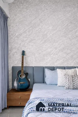 Scandinavian bedroom with grey textured wall, blue upholstered headboard, and wooden nightstand