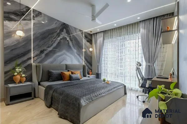 Modern bedroom with grey marble-look accent wall and beige marble floor tile in Salarpuria Symphony Electronic City 3 BHK apartment Bengaluru