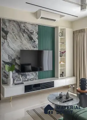 Modern living room with marble-look laminate TV unit, green fluted panels, and glossy white cabinetry in Salarpuria Symphony Electronic City 3 BHK apartment Bengaluru