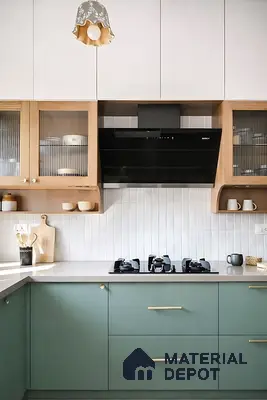 Scandinavian kitchen with sage green laminate, white quartz countertop, and vertical white subway backsplash tile