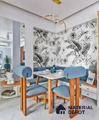 Modern dining room with tropical floral wallpaper, blue upholstery, and white marble look floor tile in Sattva East Crest old madras road 2 BHK apartment Bengaluru