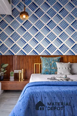 Eclectic bedroom with blue geometric patterned wallpaper and walnut wood paneling