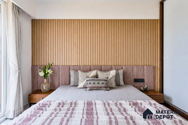 Scandinavian bedroom with vertical wood fluted wall panels and patterned upholstered headboard