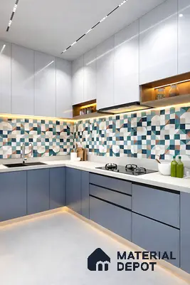 Modern kitchen with blue and white laminate cabinets, geometric patterned backsplash tiles, and white quartz countertop