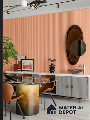 Modern dining room with peach fluted wall panels, marble dining table, and leather chairs of 4 BHK apartment in Sobha Windsor Whitefield in Bengaluru