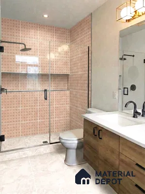 Modern bathroom with blush pink patterned wall tiles, white marble floor tiles, and wood laminate vanity