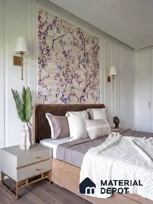 Modern bedroom with floral wallpaper, suede upholstered bed, and light wood flooring