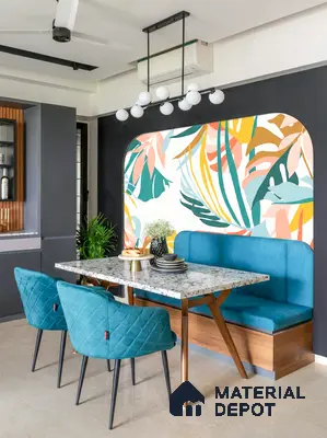 Modern dining room with terrazzo tabletop, teal upholstery, and tropical patterned wallpaper