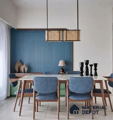 Scandinavian dining room with blue fluted wall panels, marble tabletop, and wooden frame chairs