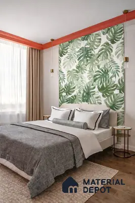 Modern bedroom with tropical leaf wallpaper, beige upholstered bed, and wooden flooring