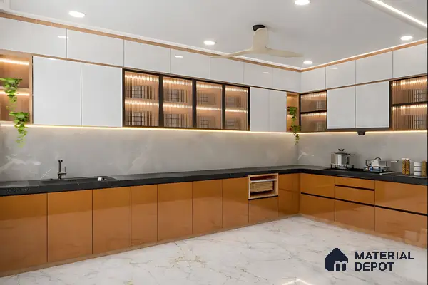 Modern dual tone kitchen with glossy white and amber brown laminate, black quartz countertop, and marble floor tile