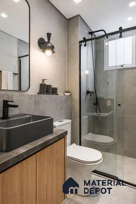 Modern bathroom with grey stone tiles, black countertop basin, and wood laminate vanity
