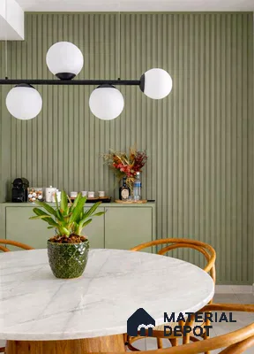 Scandinavian dining room with sage green fluted wall panels and white marble dining table