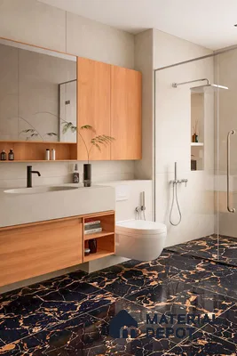 Modern bathroom with black marble floor tiles and light wood laminate vanity