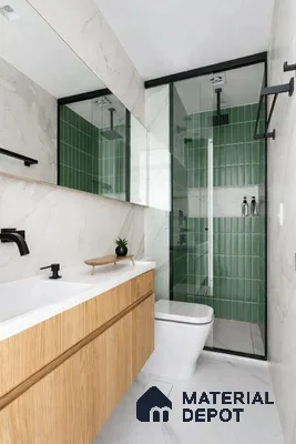 Modern bathroom with green kitkat wall tiles, white marble-look tiles, and oak wood vanity
