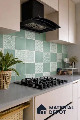 Modern kitchen with sage green patterned backsplash tiles and frosty white laminate cabinets