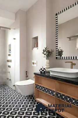 Modern bathroom with black-and-white geometric floor tiles and light beige wall tiles in 3 BHK apartment Skav Aastha Mahalakshmi layout Bengaluru