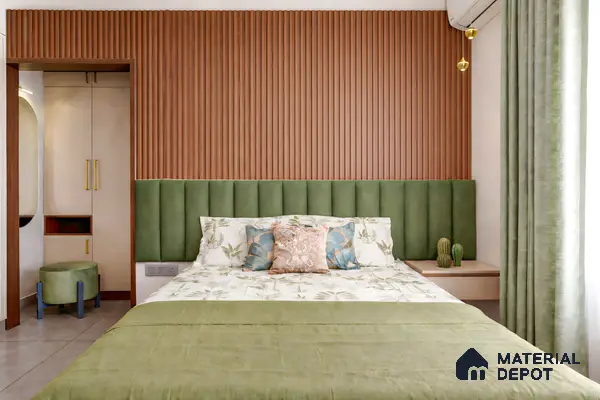 Modern bedroom with green suede upholstered headboard, wooden fluted wall panels, and beige wardrobe in 3 BHK apartment Skav Aastha Mahalakshmi layout Bengaluru