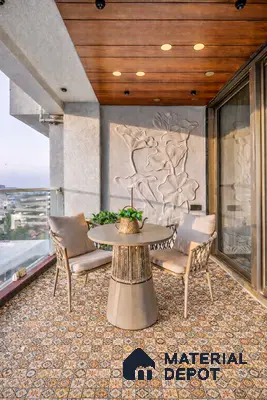Mediterranean balcony with patterned moroccan floor tiles, wooden ceiling panels, and floral carved wall