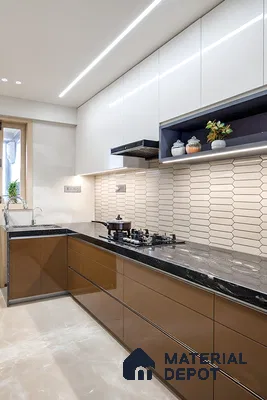 Modern L-shaped kitchen with glossy brown laminate, white high gloss laminate, black marble countertop, and geometric beige wall tiles of 3 BHK apartment in Sobha City Casa Paradiso  Bengaluru
