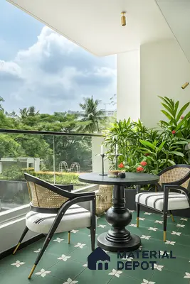 Modern balcony with green patterned floor tiles and cane accent chairs of 2 BHK apartment in Sobha Tropical Greens At Dream Acres Varthur in Bengaluru