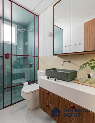 Modern bathroom with teal geometric wall tiles, wood laminate vanity, and off-white wall tiles of 2 BHK apartment in Sobha Tropical Greens At Dream Acres Varthur in Bengaluru