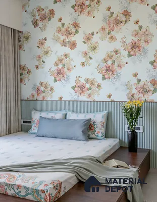 Modern bedroom with floral wallpaper, pastel fluted wall panel, and wooden bed platform of 2 BHK apartment in Sobha Tropical Greens At Dream Acres Varthur in Bengaluru