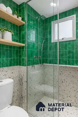 Modern bathroom with green subway wall tiles and terrazzo wall and floor tiles